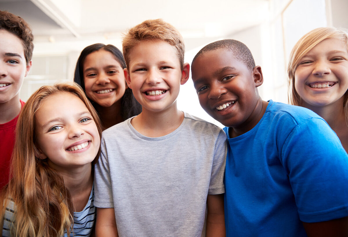 A group of kids posing for a photo.